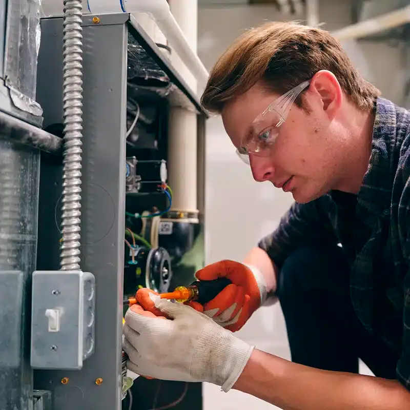 technician working on furnace